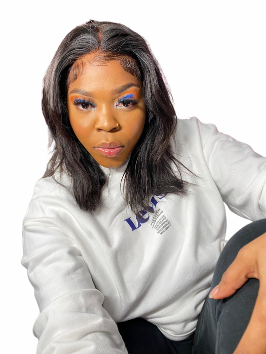 Woman wearing Diamond Beauty straight hair lace wig human hair styled with middle part